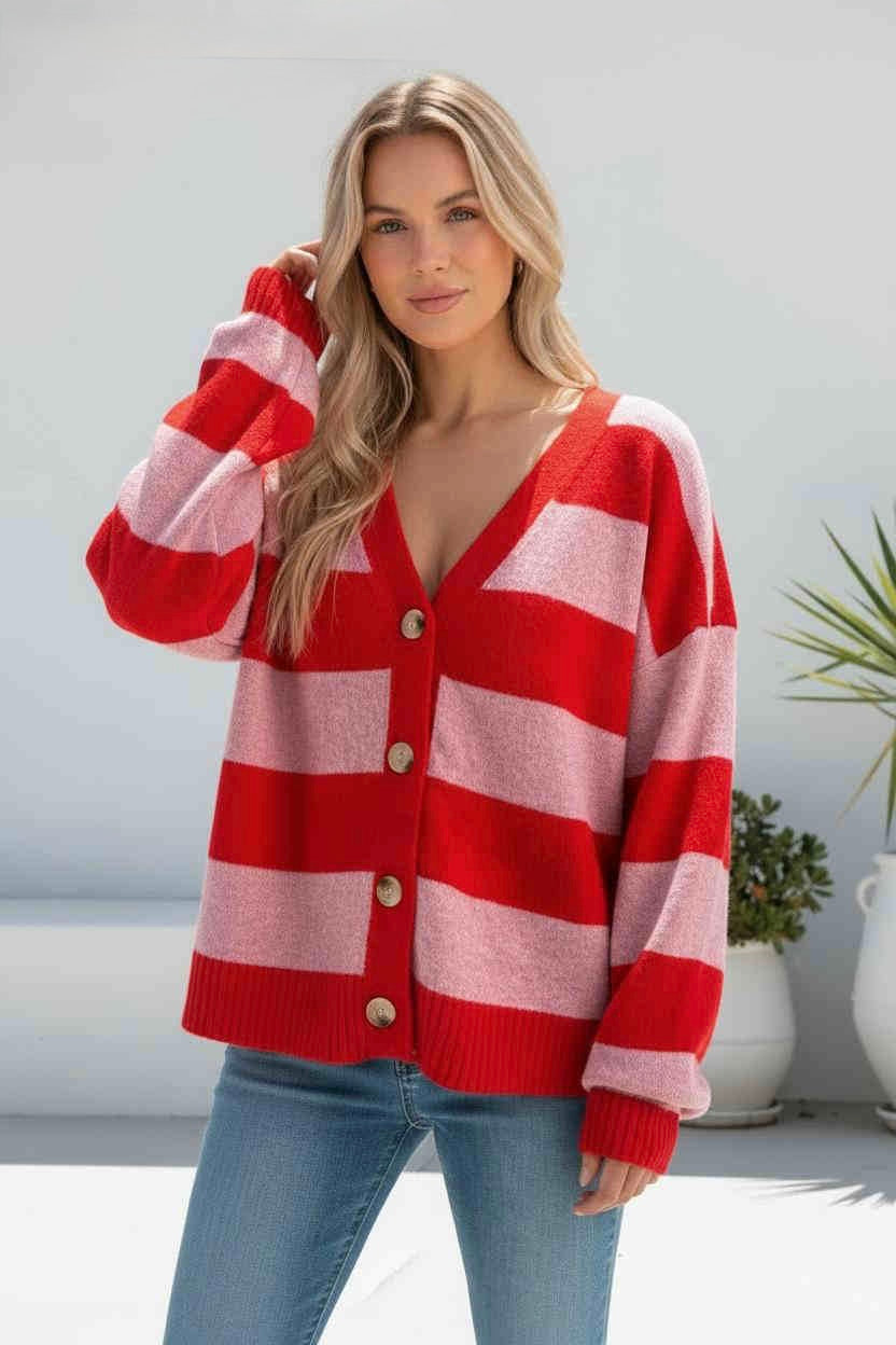 Bold, playful, and effortlessly chic, the Polly Cardigan is a vibrant knit featuring striking red and soft pink wide stripes for the ultimate statement look. Designed with a flattering relaxed fit, oversized sleeves, and a classic V-neckline, it’s finished with large button-front detailing for an elevated touch. Soft, cozy, and perfect for layering, this eye-catching piece adds a fun pop of colour to your wardrobe while keeping your style comfortable and on-trend. Perfect paired with denim for an easy luxe 
