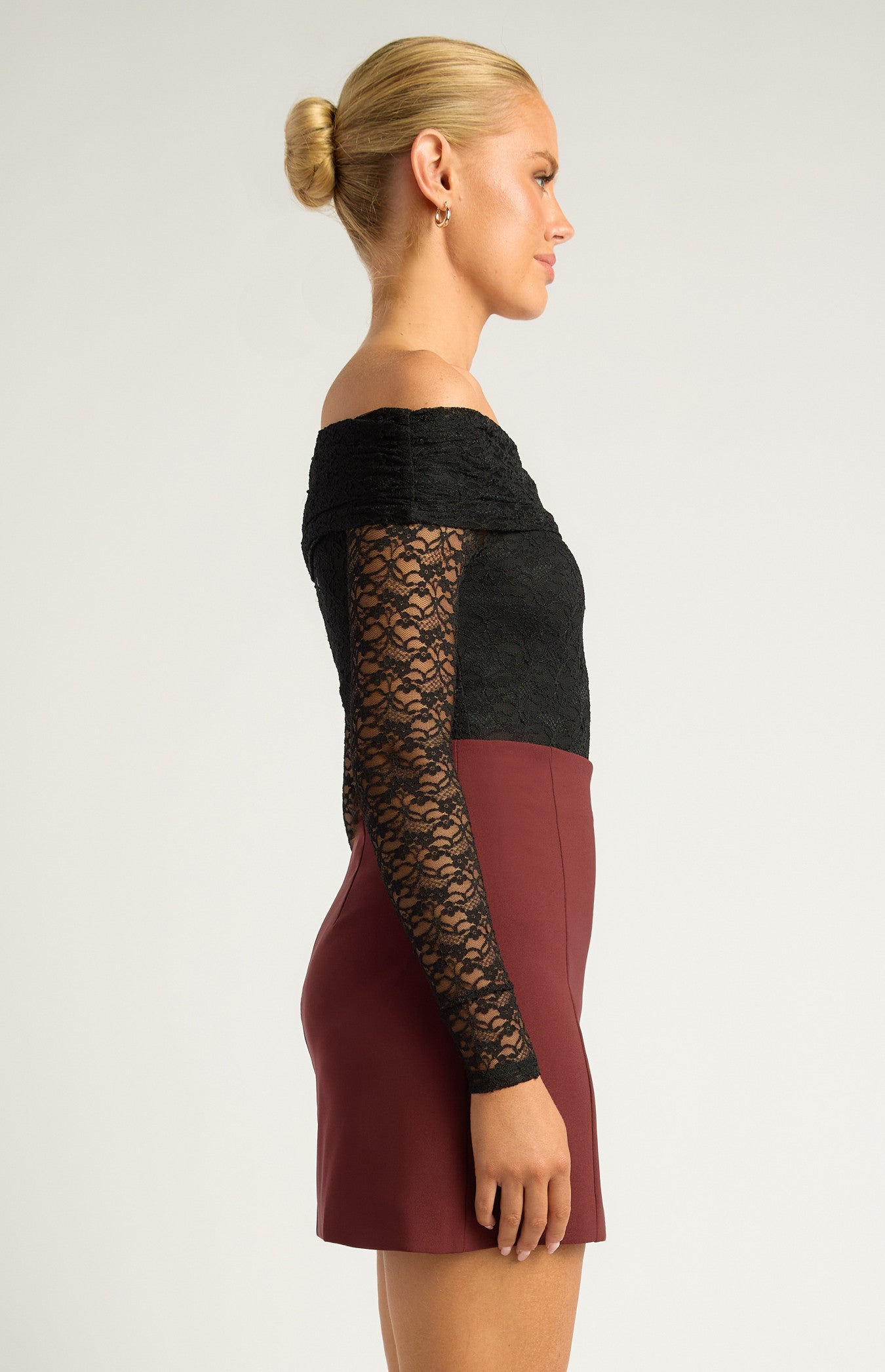  Black Lace Bodysuit Bold and sultry with a fully sheer lace sleeve and bodice look off-the-shoulder cut, but gives a strong, edgy aesthetic Intricate lace detailing creates texture and depth Figure-hugging and streamlined, ideal for a night-out or statement look Style with leather, denim, or tailored pieces for contrast
